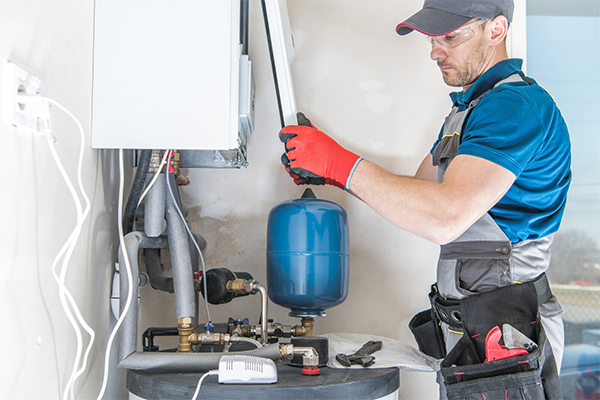 technician repairing the boiler product system